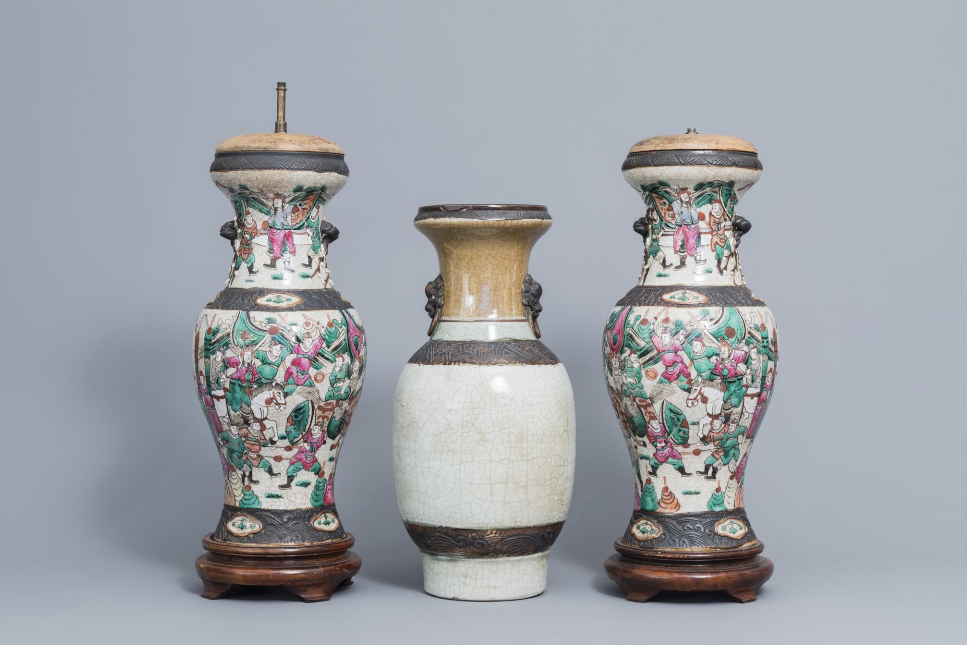 A pair of Chinese Nanking famille rose vases with warrior scenes & a Nanking celadon vase, 19th C. - Image 3 of 6
