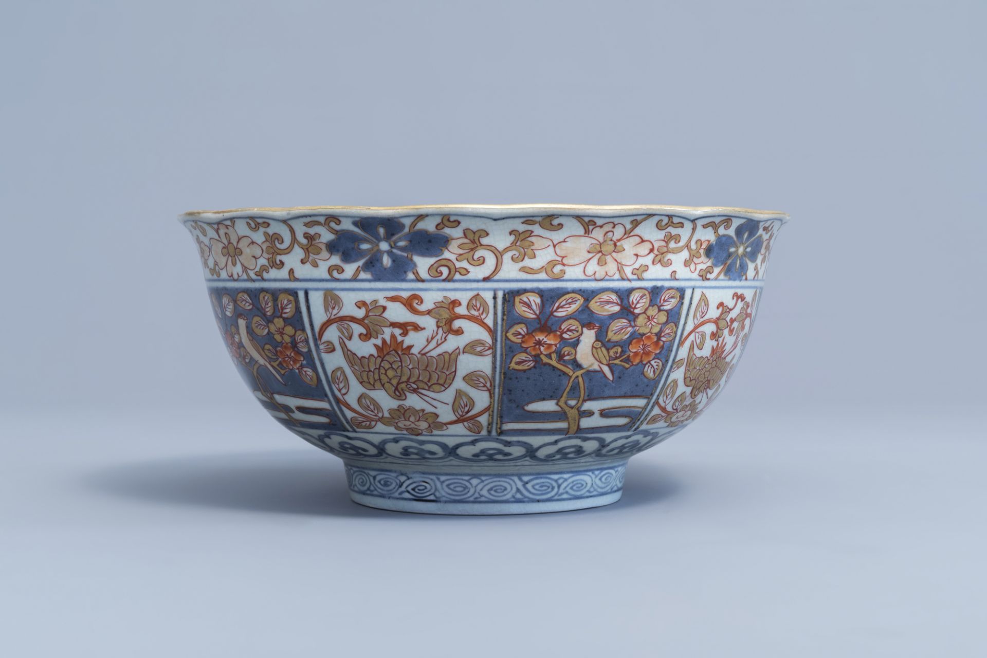 A Japanese Imari bowl with birds among blossoming branches and figures, Edo, 18th C. - Image 3 of 7