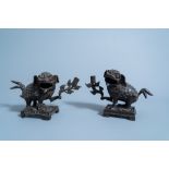 A pair of Chinese bronze 'mythical beast' candlesticks, Qing