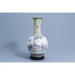 A large Chinese bottle shaped famille rose vase with ladies on a terrace, Qianlong mark, 20th C.