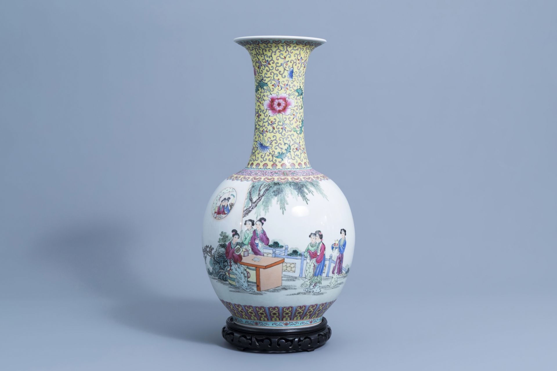 A large Chinese bottle shaped famille rose vase with ladies on a terrace, Qianlong mark, 20th C.