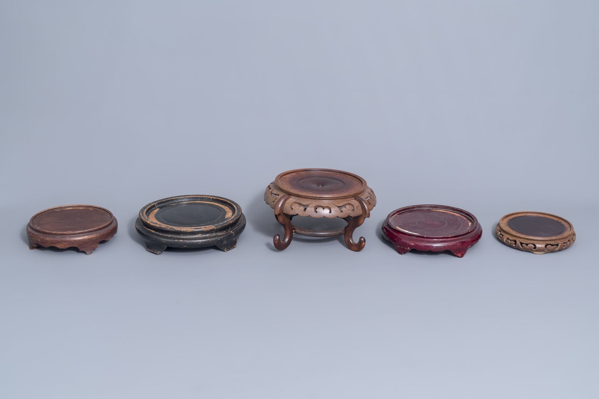 A collection of Chinese wooden stands and a carved wooden stand with marble top, 19th/20th C. - Image 3 of 14