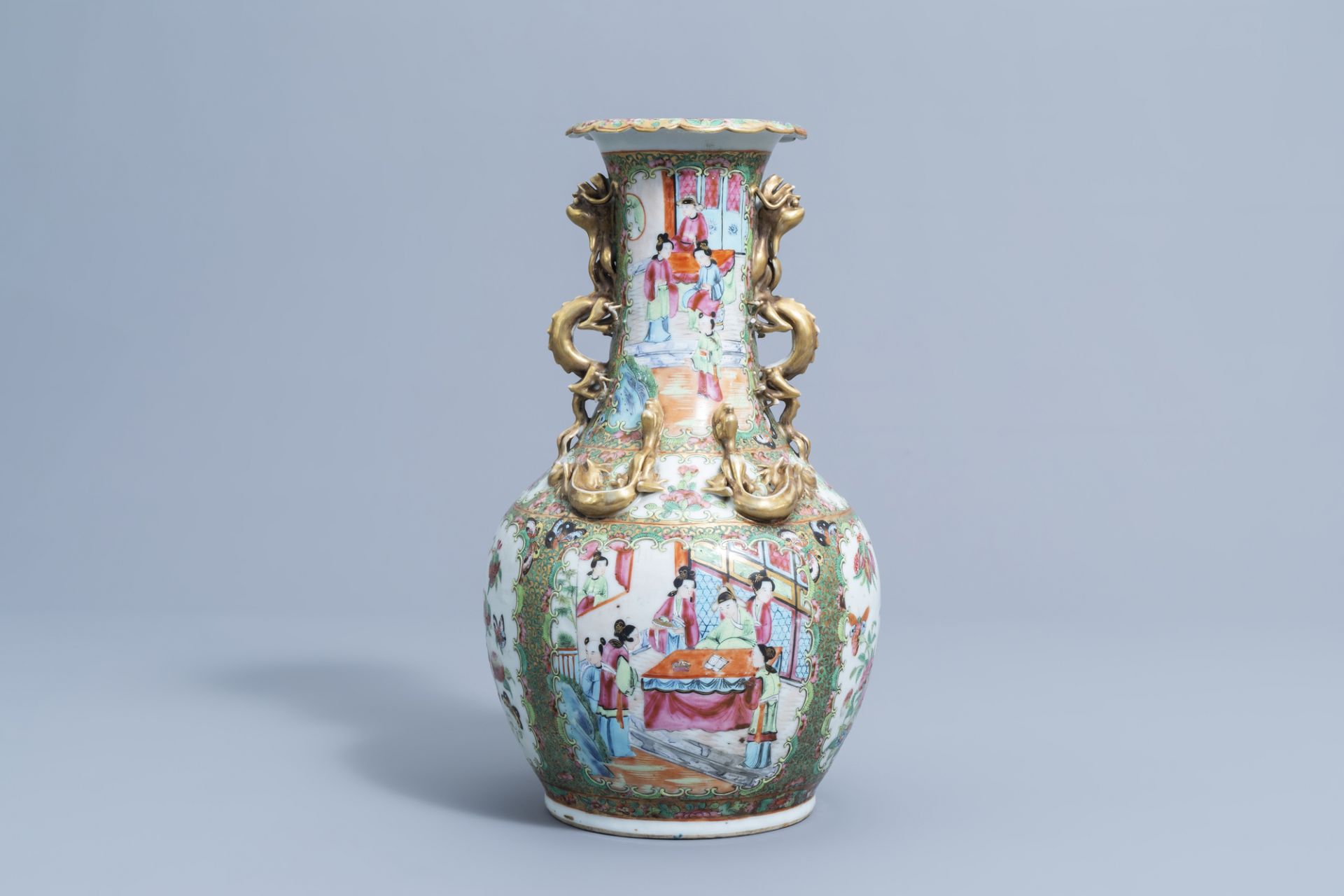 A Chinese Canton famille rose relief decorated 'dragons' bottle vase, 19th C. - Image 3 of 6