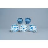 Five Chinese blue and white cups and saucers with floral design and a boy and a buffalo in a landsca