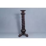 A Chinese or Vietnamese carved wooden column with a dragon and floral design, 19th C.