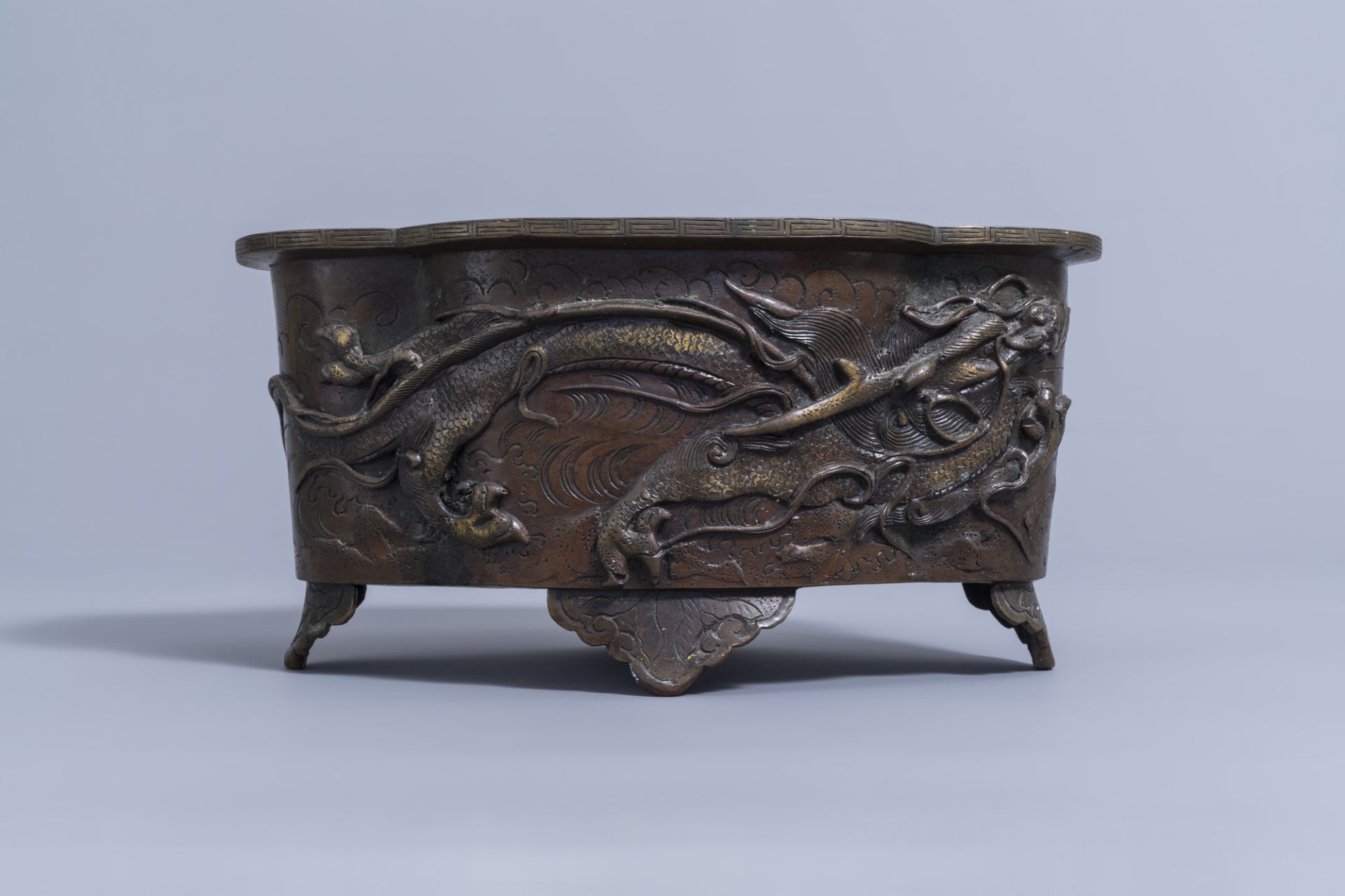 A Japanese four-lobed bronze 'dragon and phoenix' jardiniere, Meiji, 19th C. - Image 4 of 9