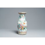 A Chinese famille rose vase with figures on a terrace all around, 19th C.