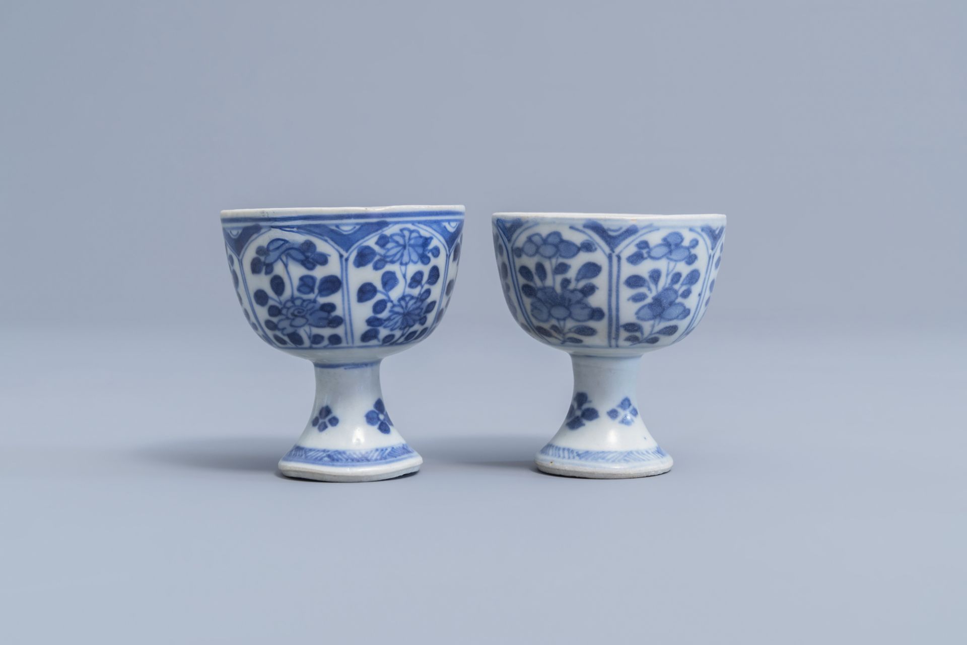 A pair of Chinese blue and white stem cups with floral design and a four-lobed teapot stand, Kangxi - Image 7 of 9