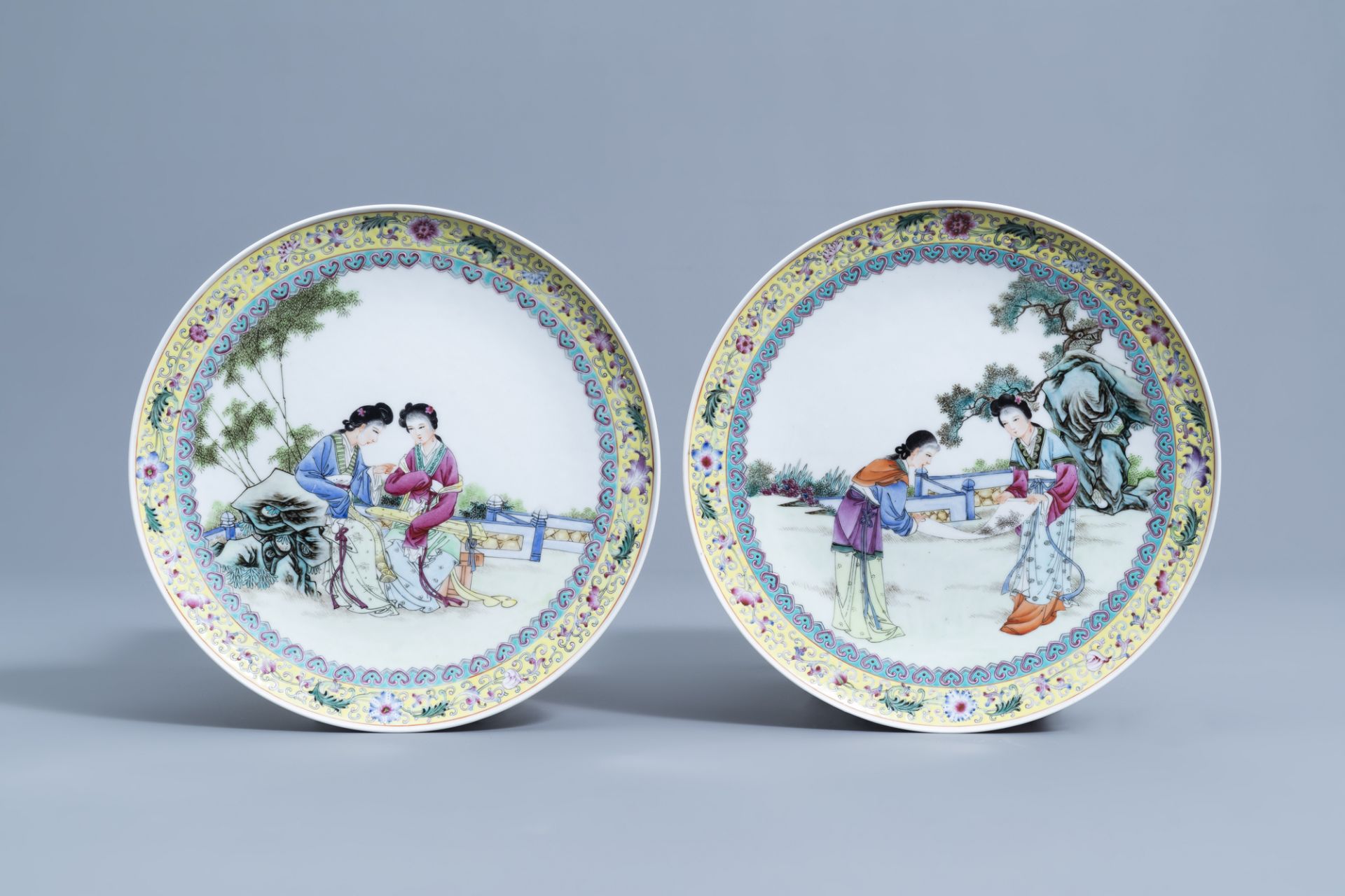 Two Chinese famille rose dishes with ladies on a terrace, Qianlong mark, 20th C.