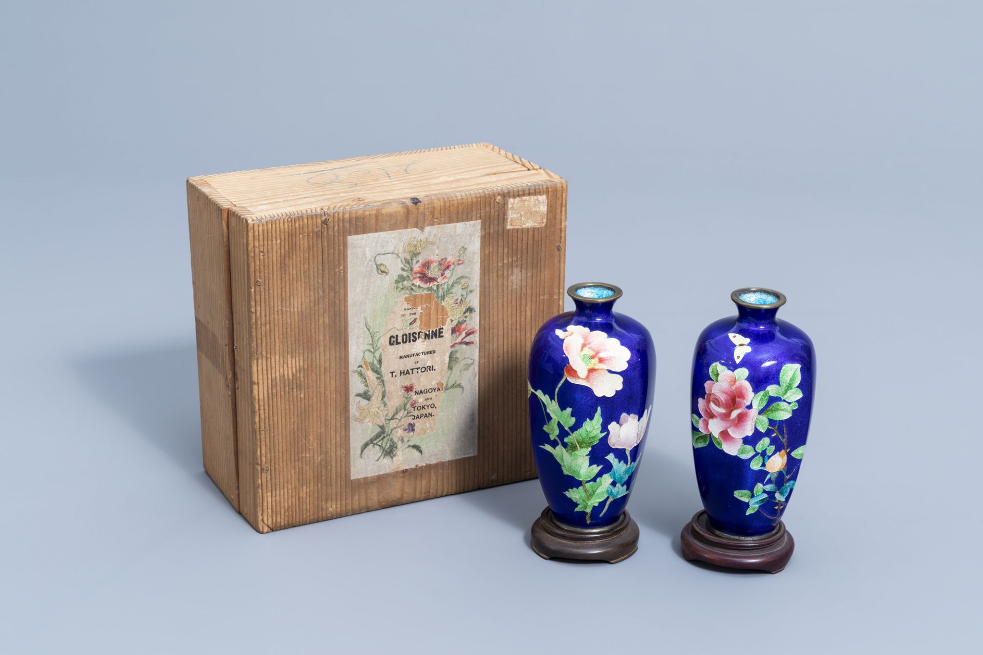 A pair of Japanese cloisonne vases with floral design, marked Hattori, Meiji, ca. 1900