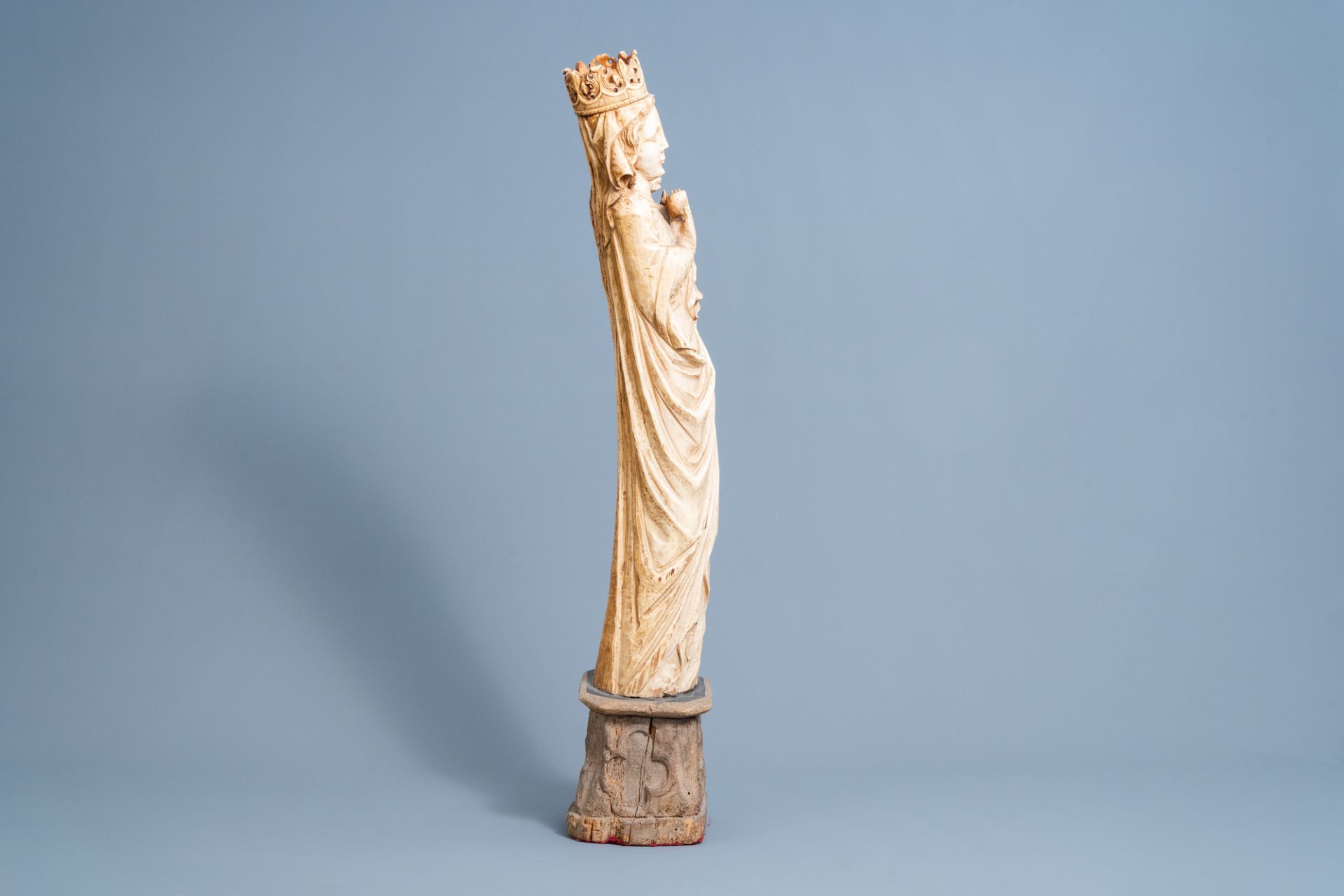 A French Gothic revival carved ivory group of Madonna and Child on an oak wooden base, probably atel - Image 4 of 6