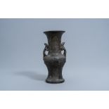A Chinese bronze archaic relief-decorated vase with chilong handles, Xuande mark, Ming