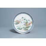 A Chinese famille rose plate with an animated river landscape, Qianlong mark, Republic, 20th C.