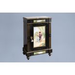 A French Historicism bronze mounted one-door cabinet with a porcelain plaque with a couple and a mar