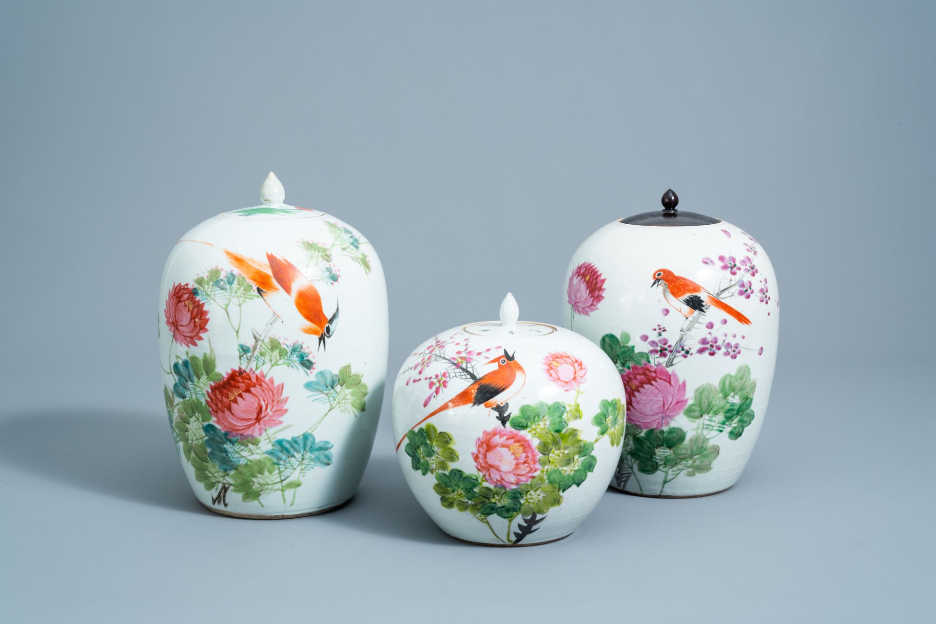 Three Chinese qianjiang cai jars and covers with a bird among blossoming branches, 19th/20th C.