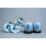 A pair of Chinese blue and white 'Shou' jars and covers on wooden stands and three dishes with anima
