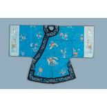 A Chinese blue ground embroidered silk women's robe with flowers and animals, 19th C.