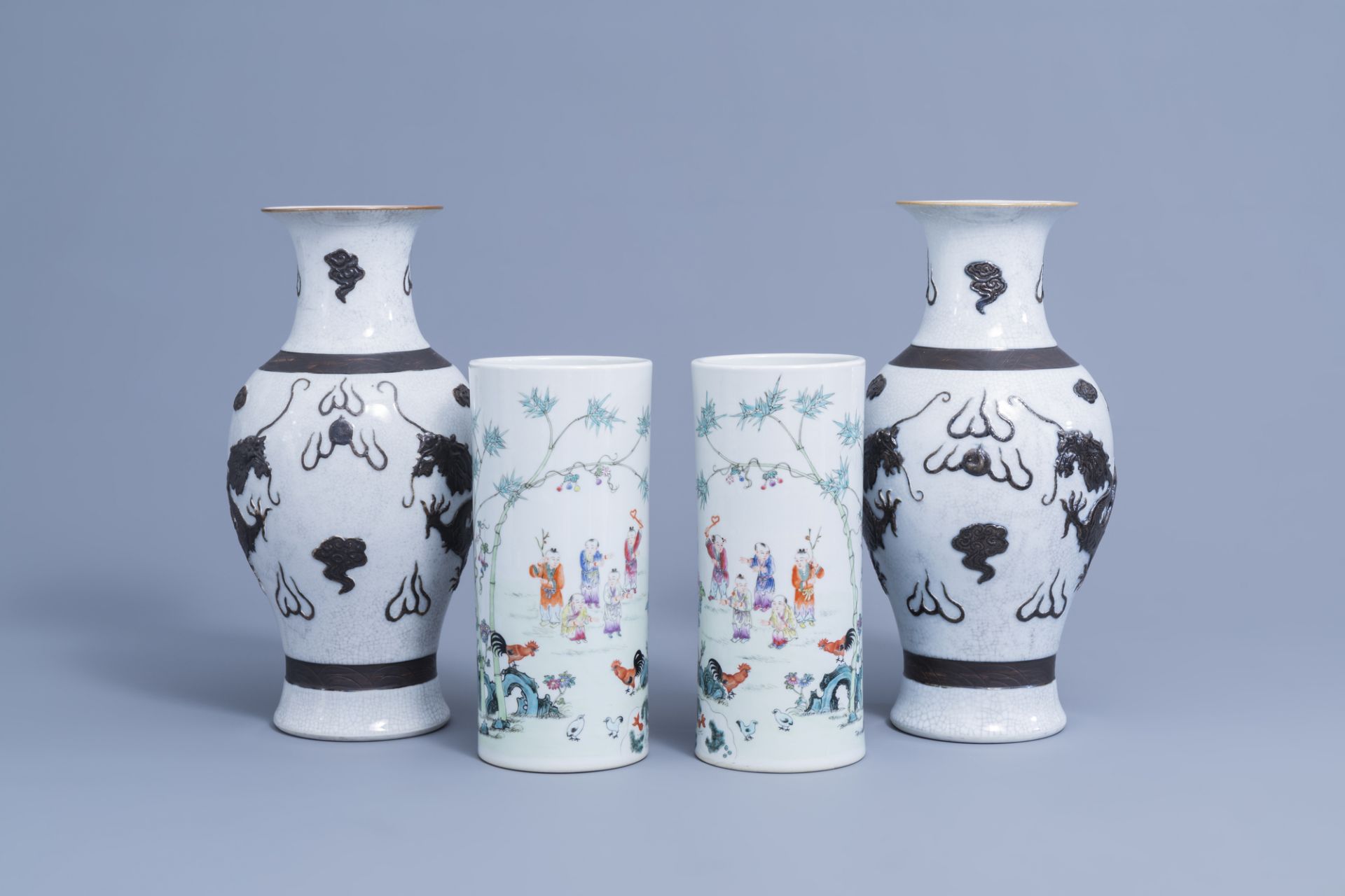 A pair of Chinese Nanking crackle 'dragon' vases & a pair of famille rose hat stands, 19th/20th C.