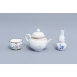 A Chinese gilt miniature teapot, a Canton enamel cup and a blue and white doll's house miniature vas