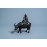 A Chinese bronze 'scholar on buffalo' censer and cover, Qing