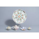 A Chinese famille verte charger with floral design and four various famille rose teapots and covers,