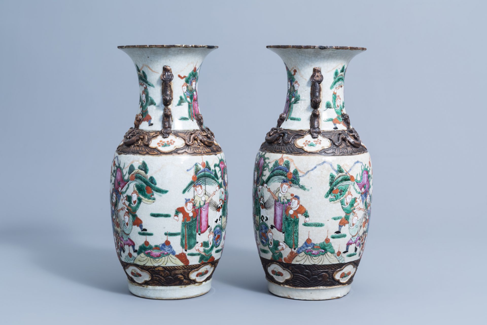 A pair of Chinese Nanking crackle glazed famille rose 'warrior' vases, 19th/20th C. - Image 4 of 6