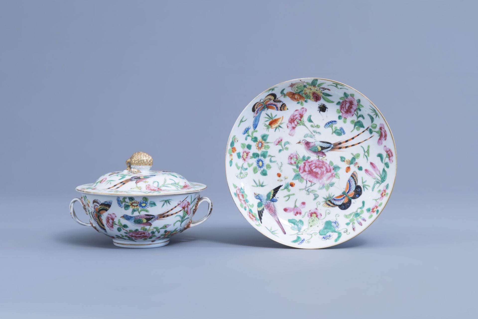A Chinese Canton famille rose bowl and cover and a dish with birds, butterflies and insects among bl