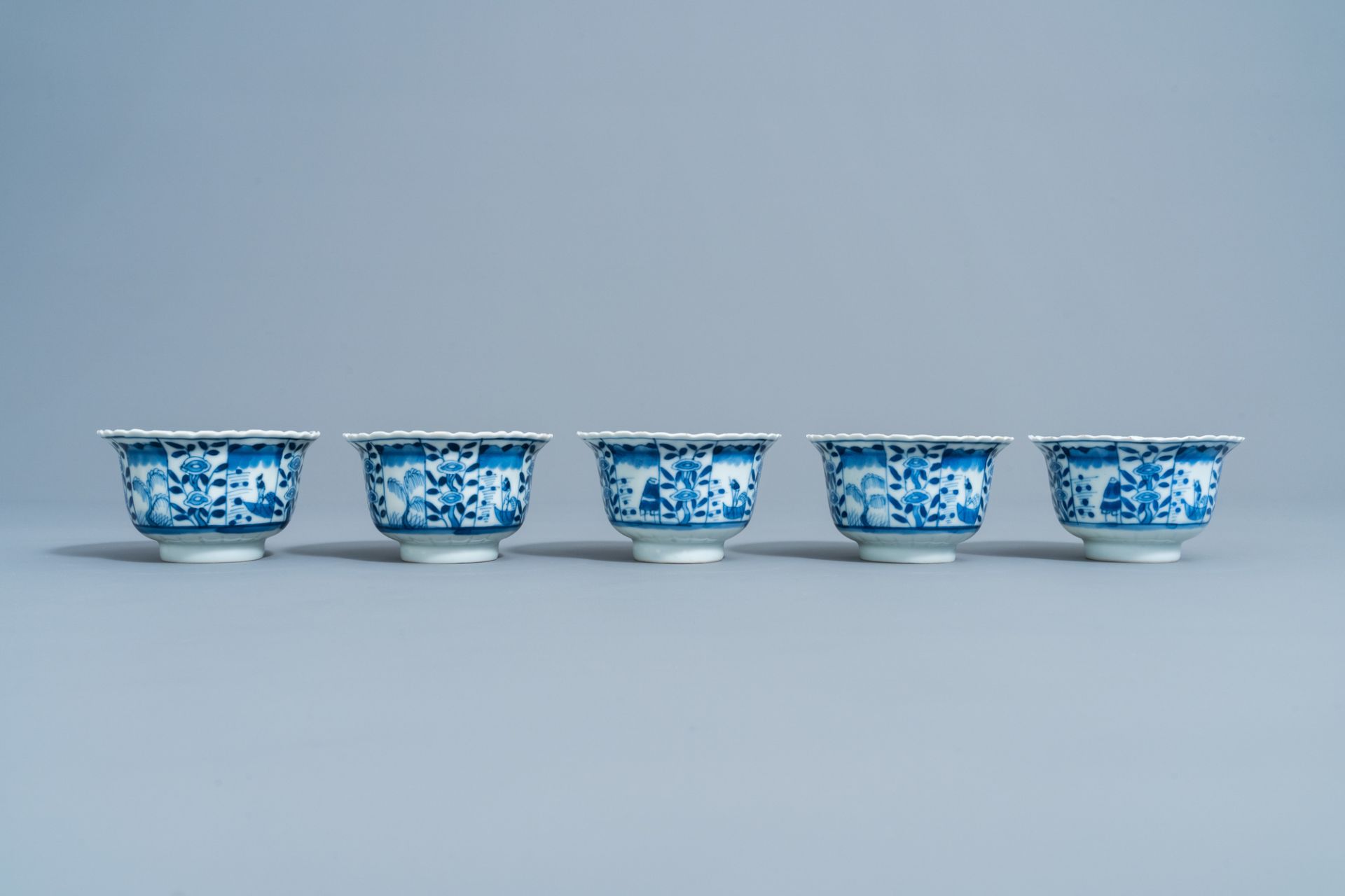 Five Chinese blue and white cups and saucers with landscapes and floral design, Kangxi mark, 19th C. - Image 6 of 9