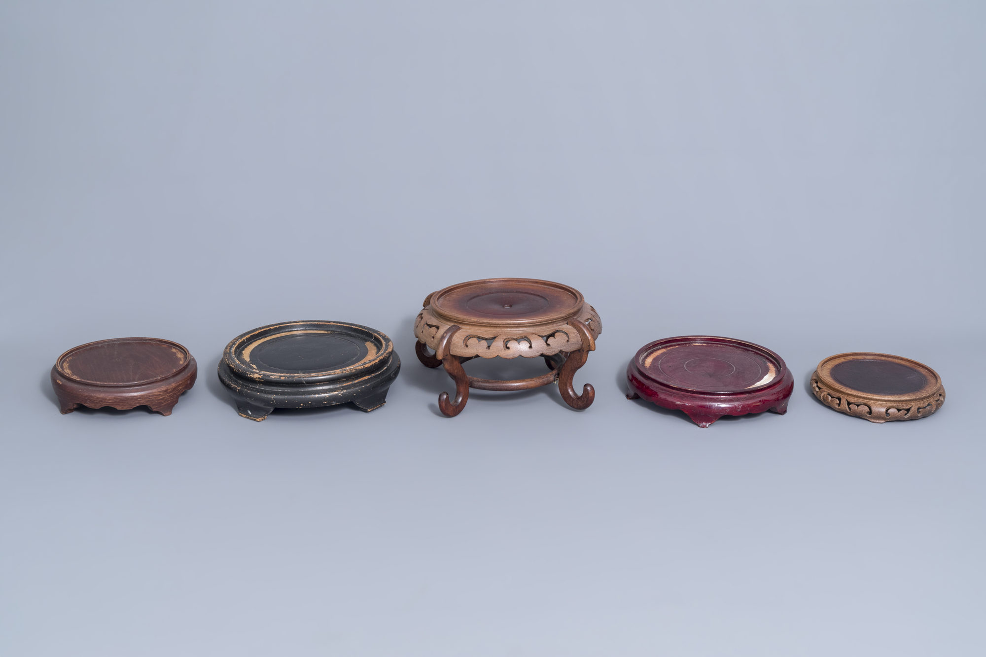 A collection of Chinese wooden stands and a carved wooden stand with marble top, 19th/20th C. - Image 4 of 14