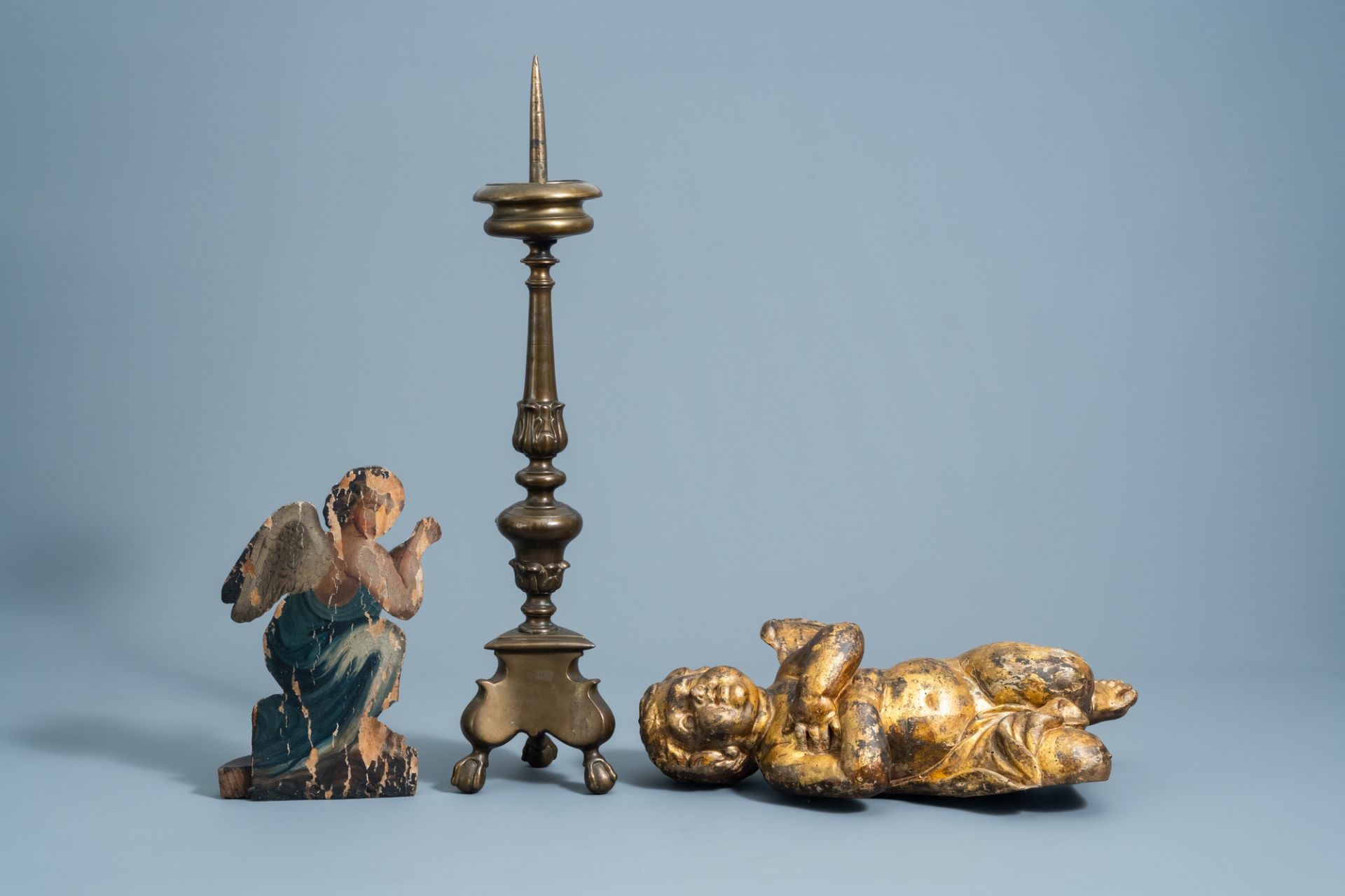 A patinated bronze pricket candlestick, a gilt wooden angel and a polychrome painted dummy board wit - Image 2 of 6