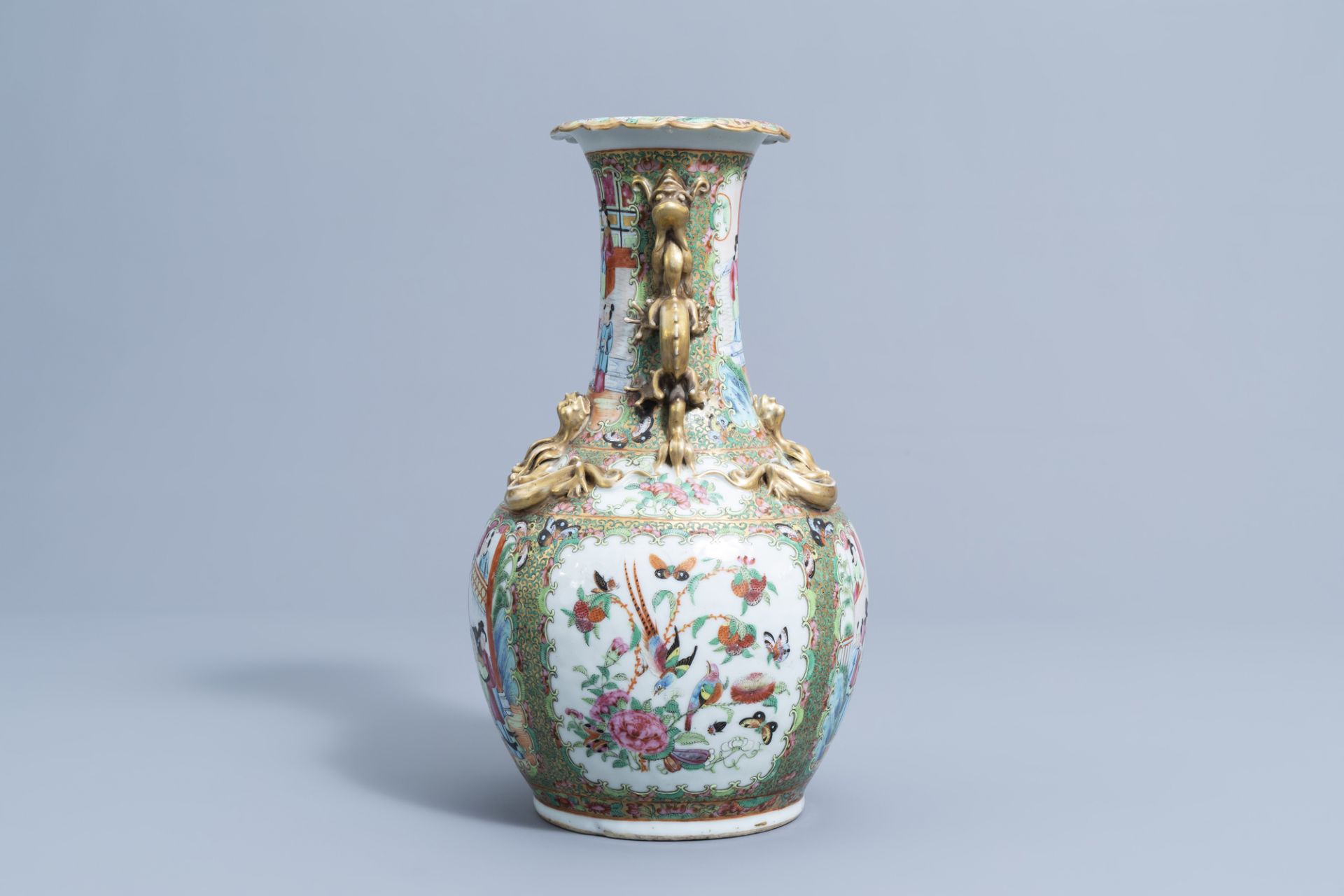 A Chinese Canton famille rose relief decorated 'dragons' bottle vase, 19th C. - Image 4 of 6