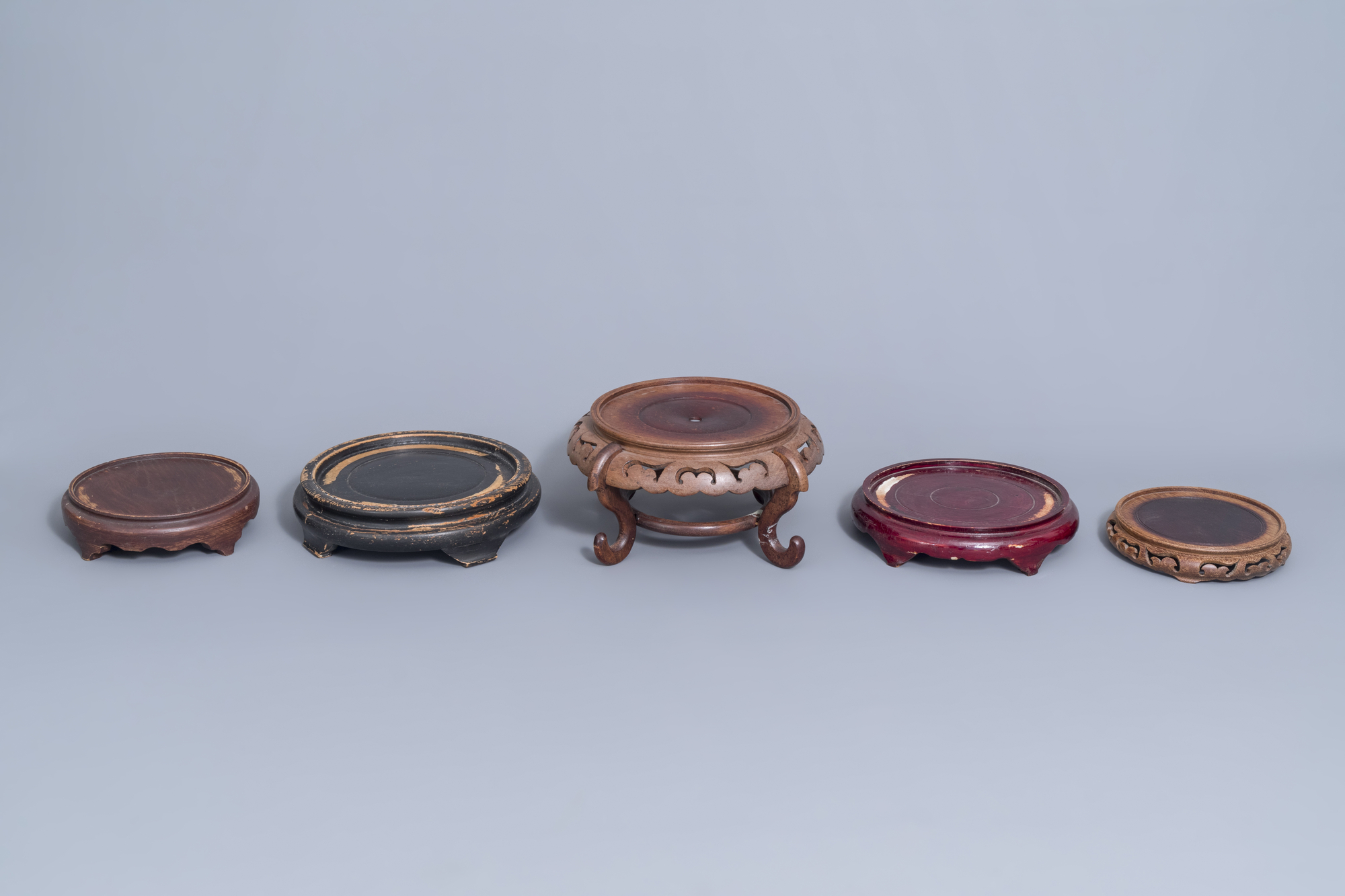 A collection of Chinese wooden stands and a carved wooden stand with marble top, 19th/20th C. - Image 6 of 14