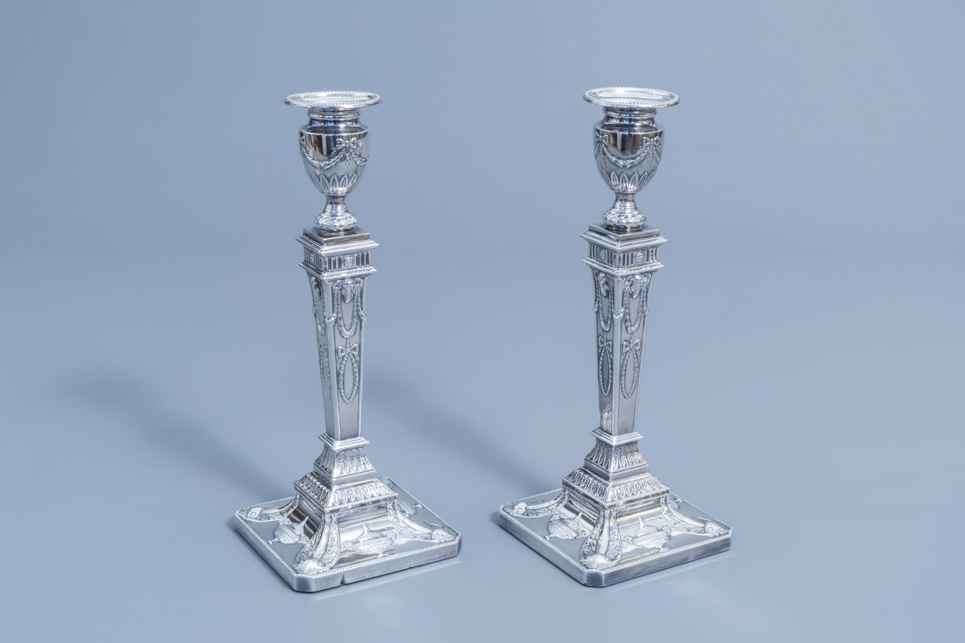 A pair of Victorian silver plated candlesticks in the style of Robert Adam, James Pinder & Co, Sheff