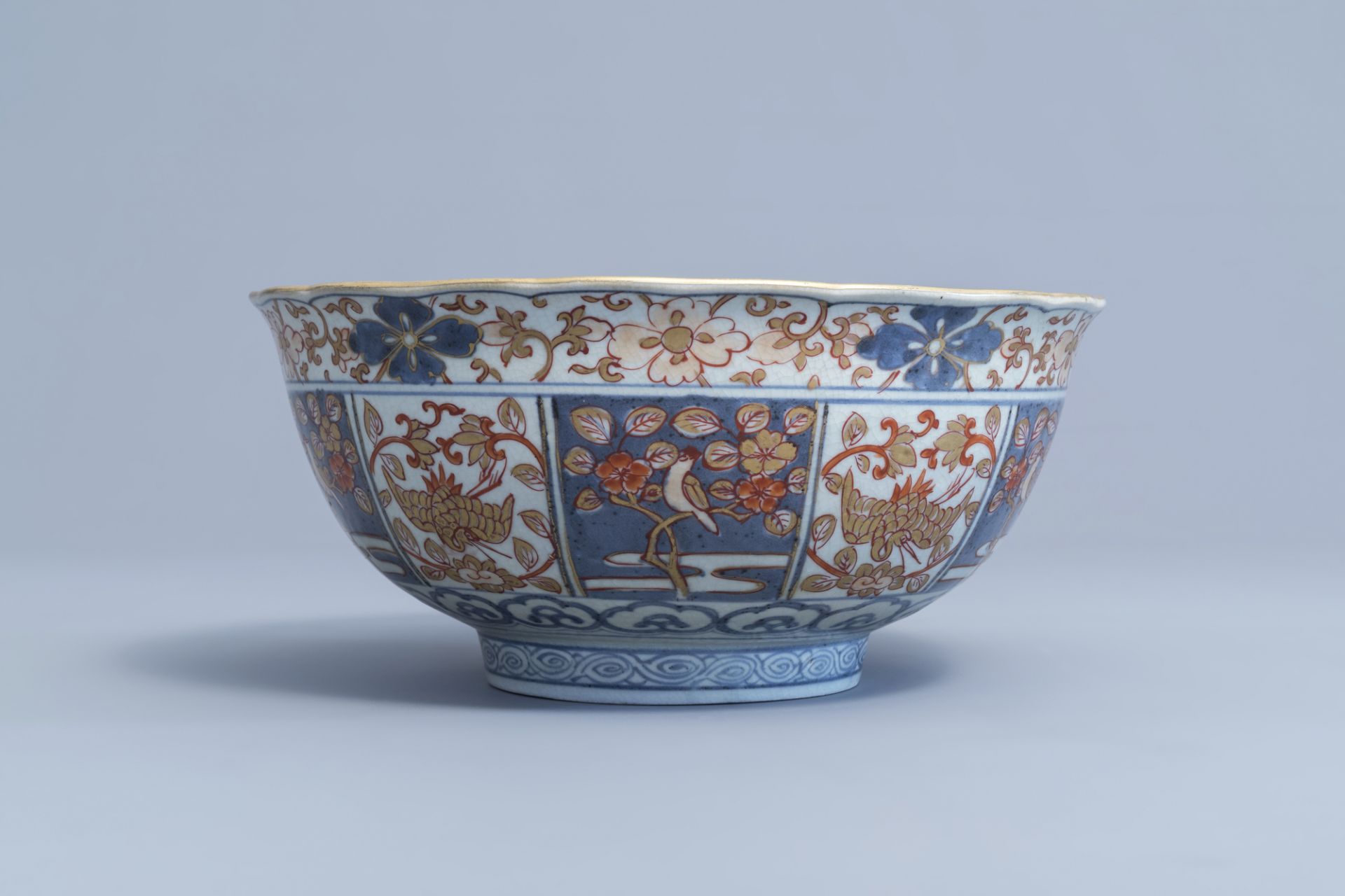 A Japanese Imari bowl with birds among blossoming branches and figures, Edo, 18th C. - Image 2 of 7