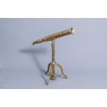 An English Stanley London brass telescope on a tripod stand, 20th C.