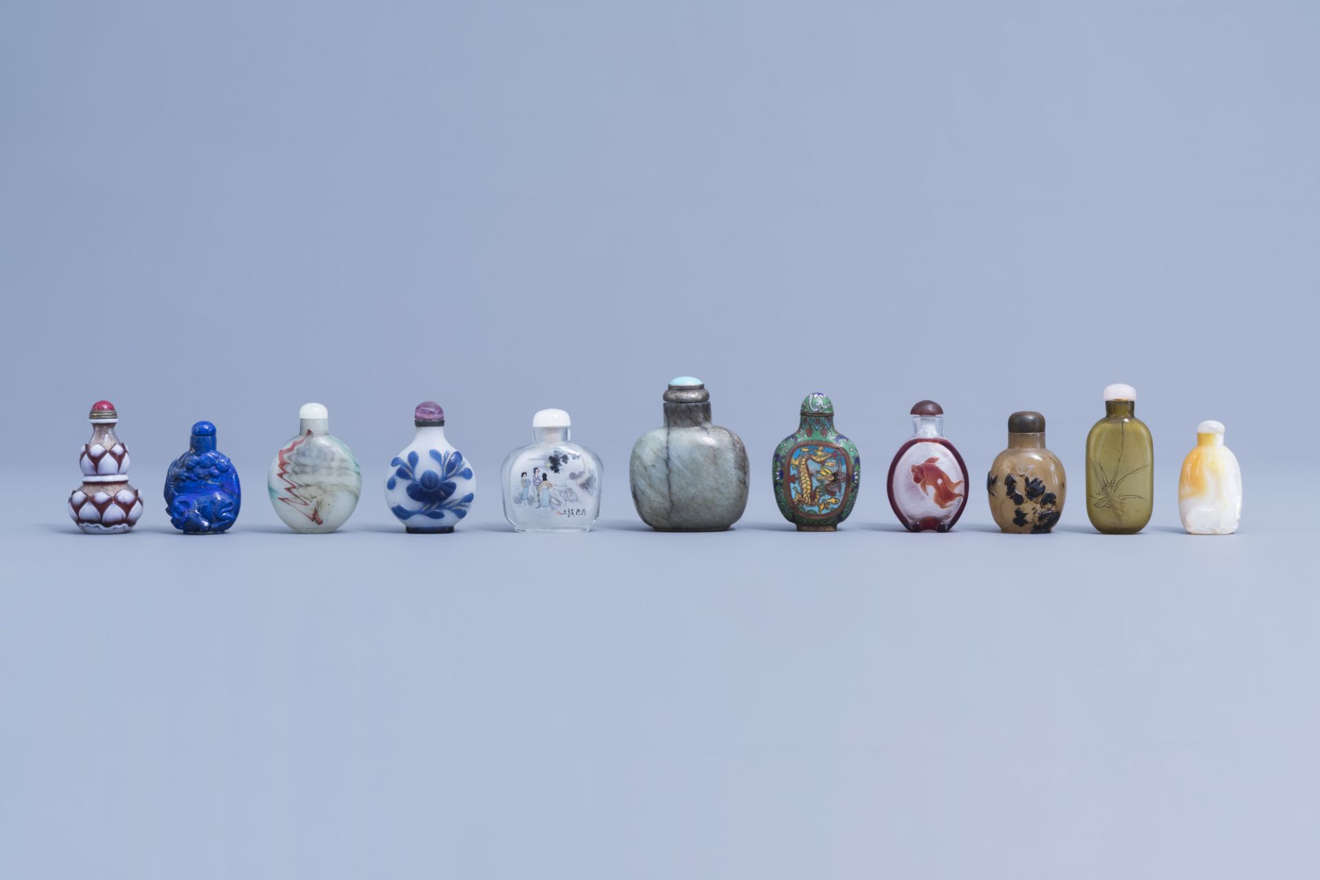 Eleven various Chinese glass and hardstone snuff bottles, 20th C.