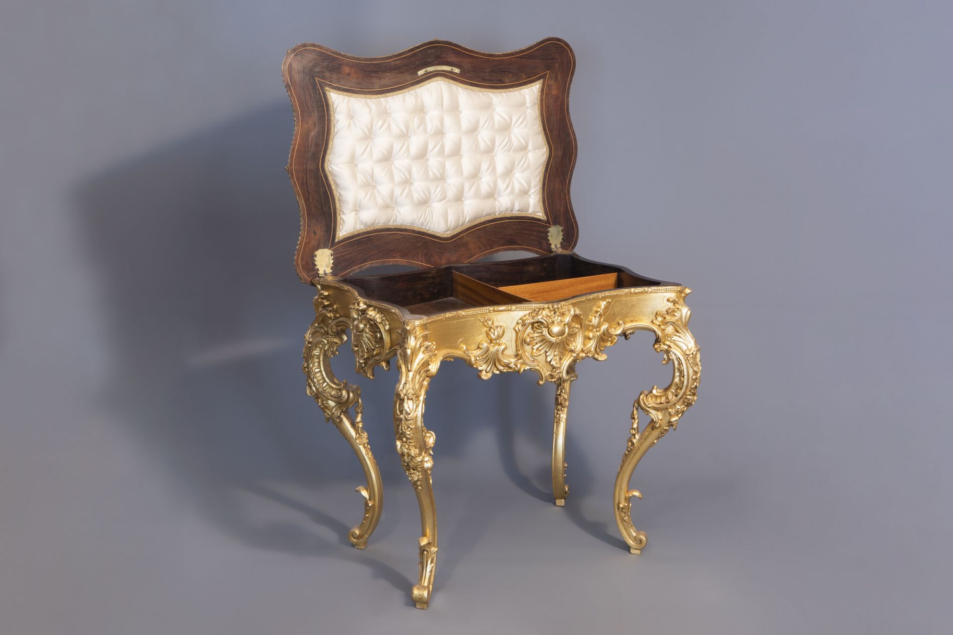 A lavish gilt Louis XV style coiffeuse with rosewood veneer inside, 19th C.