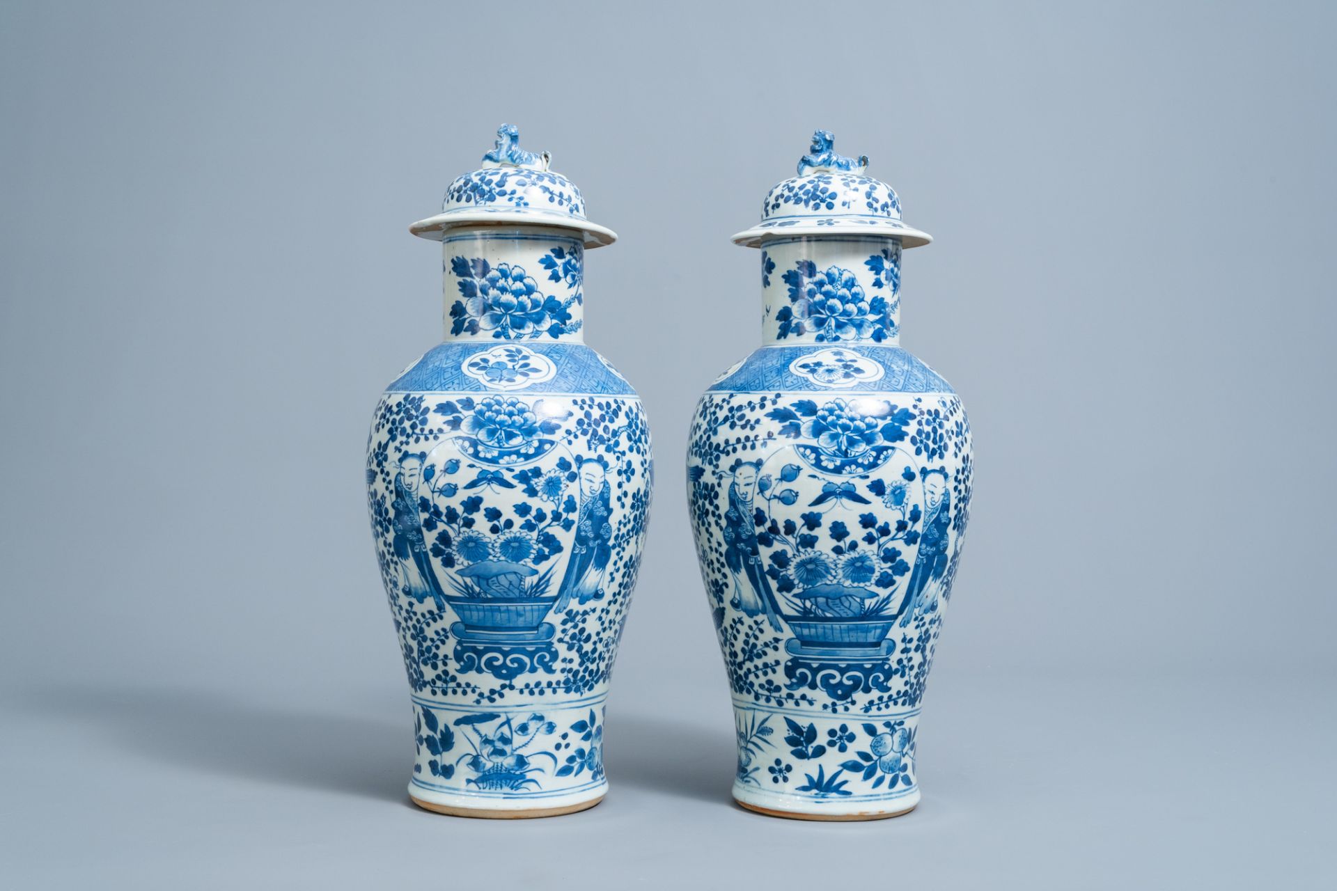 A pair of Chinese blue and white vases and covers with boys and antiquities, 19th C. - Image 3 of 6