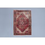 An Oriental Heriz rug with floral design, wool on cotton, Persia, mid 20th C.