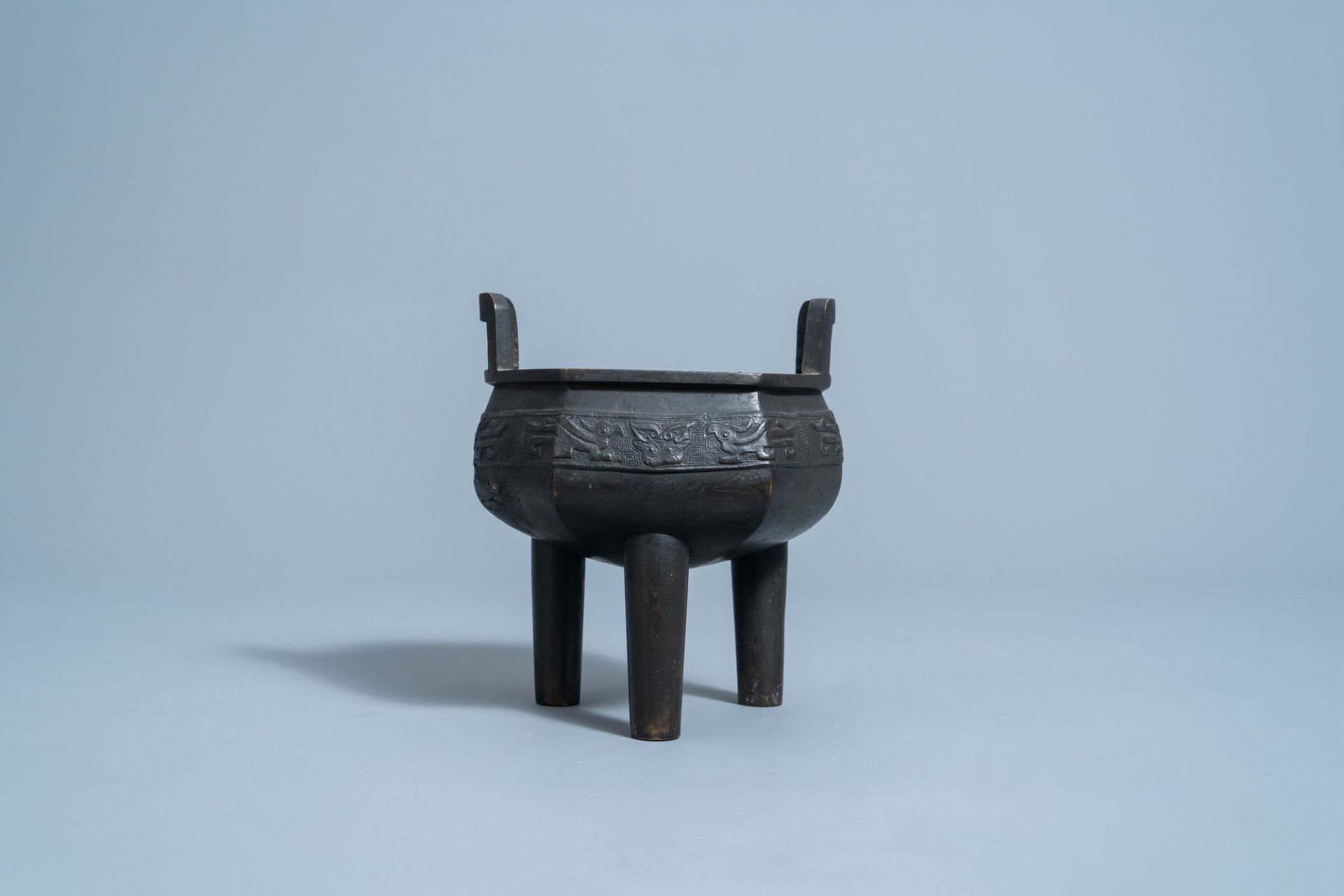 A Chinese bronze tripod censer with wooden cover and stand, Ming - Image 4 of 7