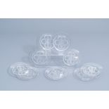 Nine French glass intaglio dishes with a putto surrounded by foliage, marked Lalique France, third q