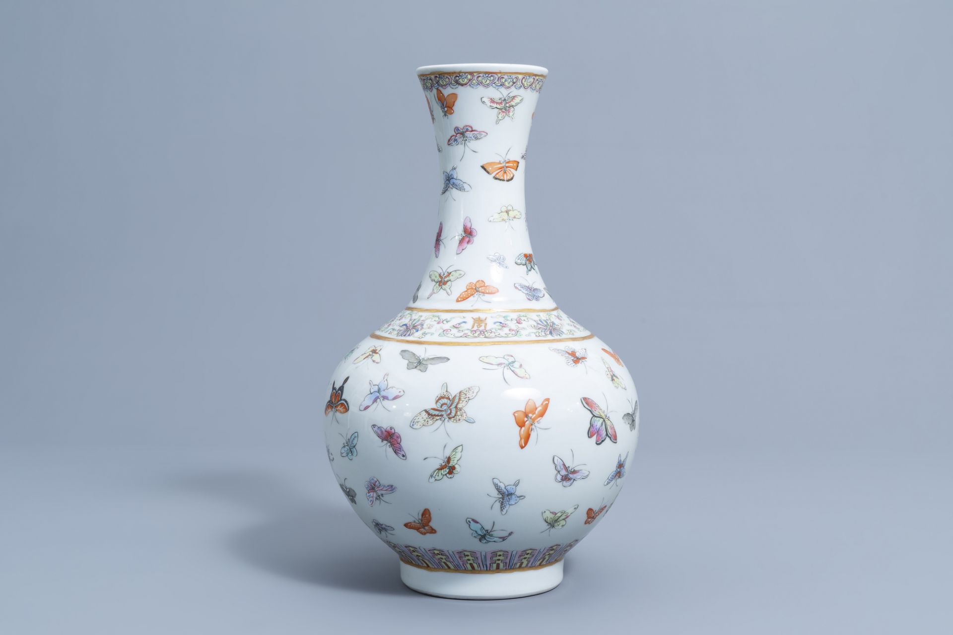 A Chinese famille rose '100 butterflies' bottle vase, Guangxu mark, 20th C. - Image 3 of 7