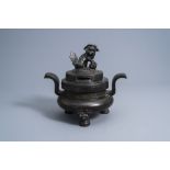 A Chinese bronze tripod censer and cover, Ming