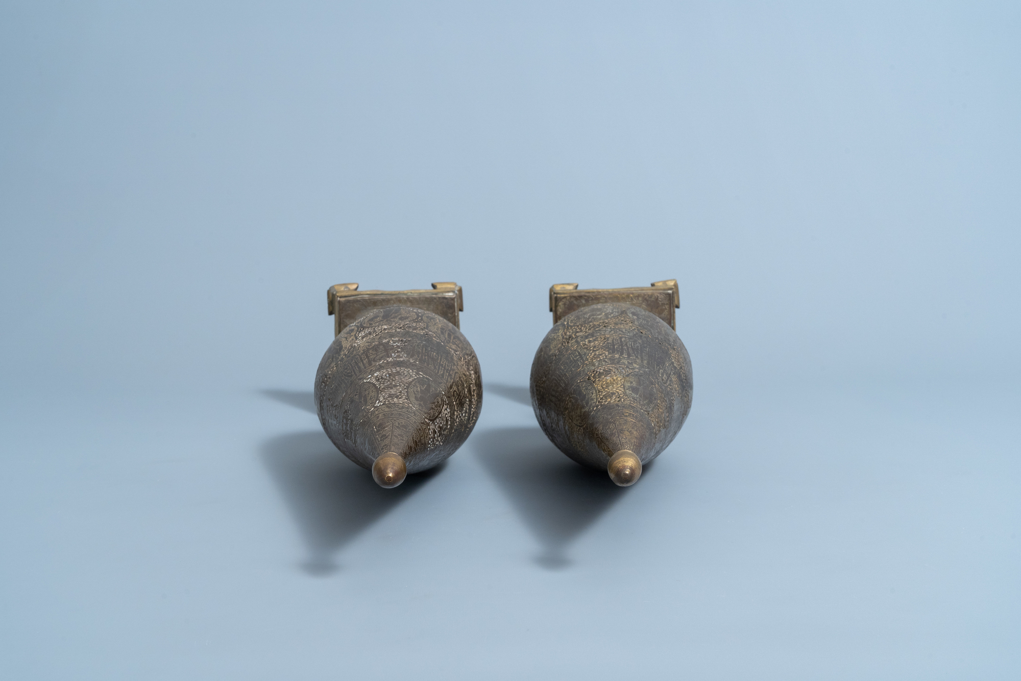 A pair of reticulated gilt bronze cone shaped ornaments with figures and calligraphy, Qajar, Iran, 1 - Image 6 of 7