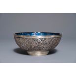 A Chinese reticulated silver bowl with blue glass interior, 19th/20th C.