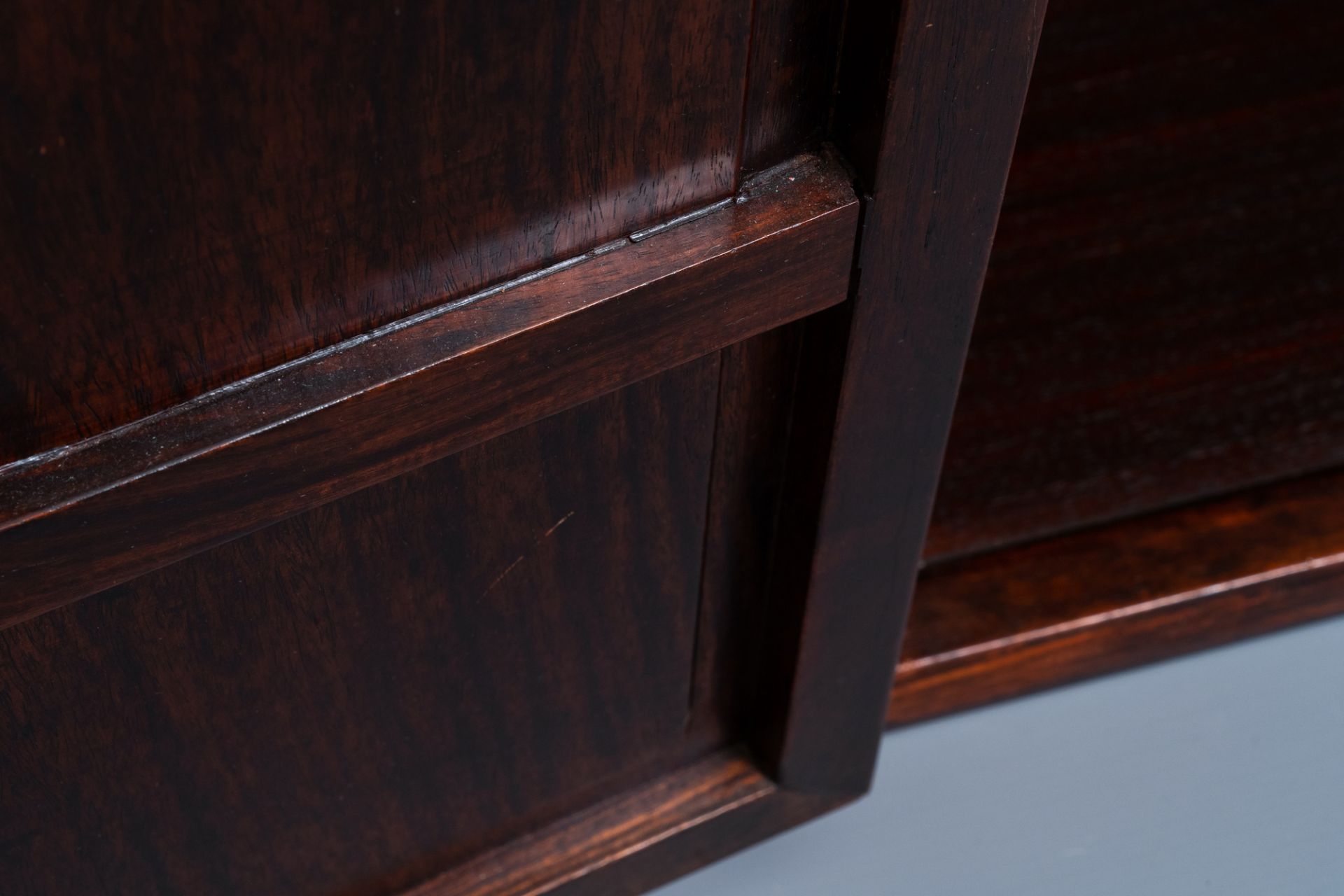 A Chinese wooden two-door cupboard with carved floral panels, 19th C. - Image 11 of 12