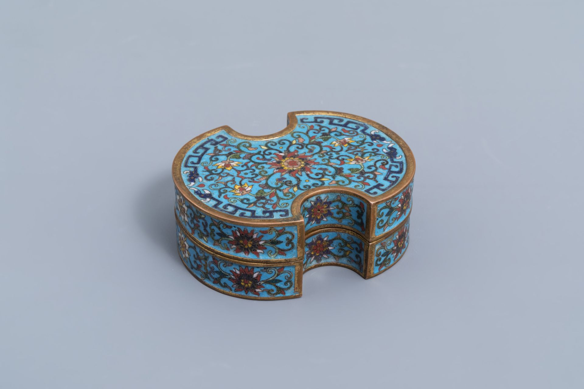 A Chinese cloisonne ingot shaped box and cover with lotus design, Qianlong mark, 19th C.