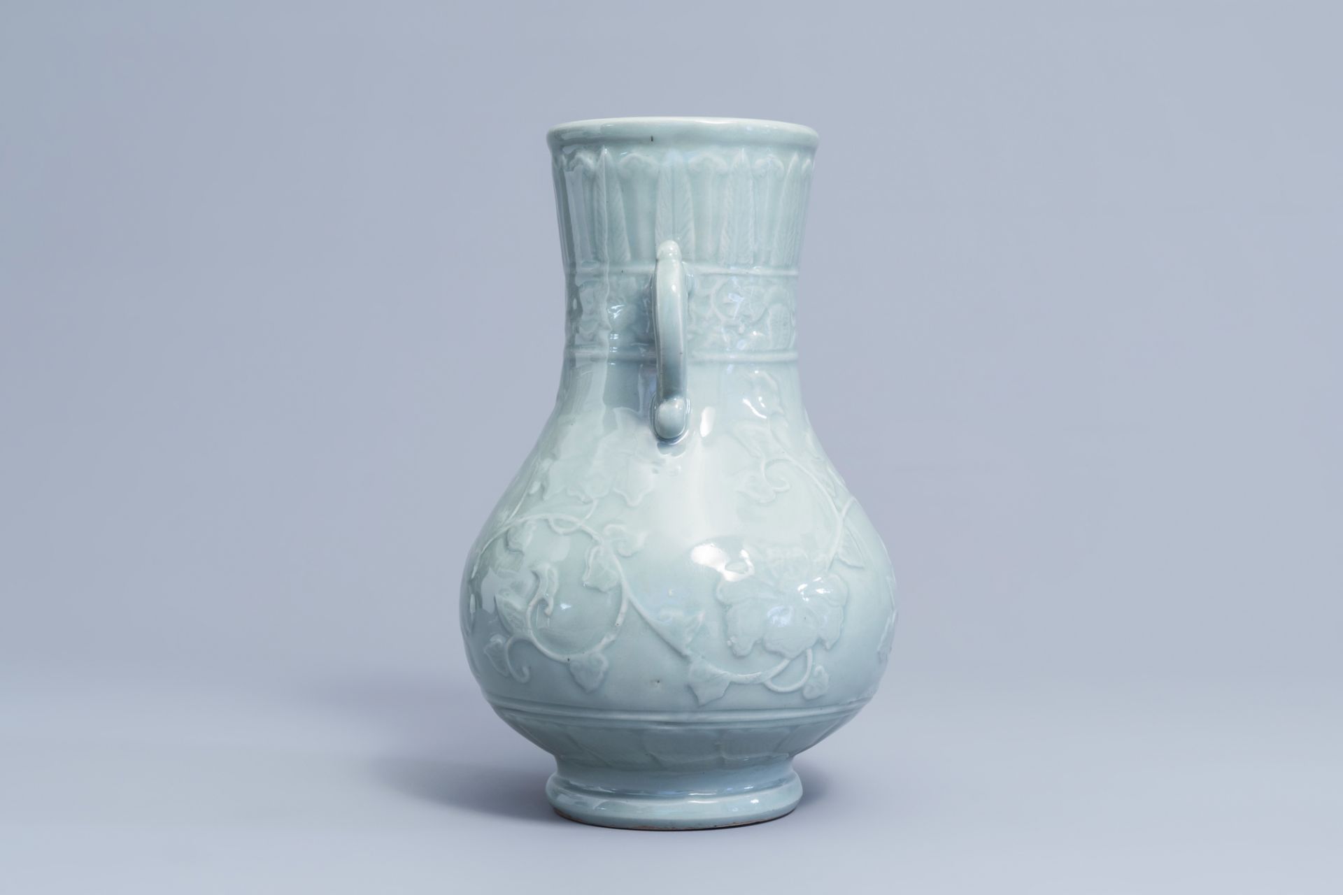 A Japanese celadon glazed 'lotus scroll' bottle vase, Edo/Meiji, 18th/19th C. - Image 2 of 6