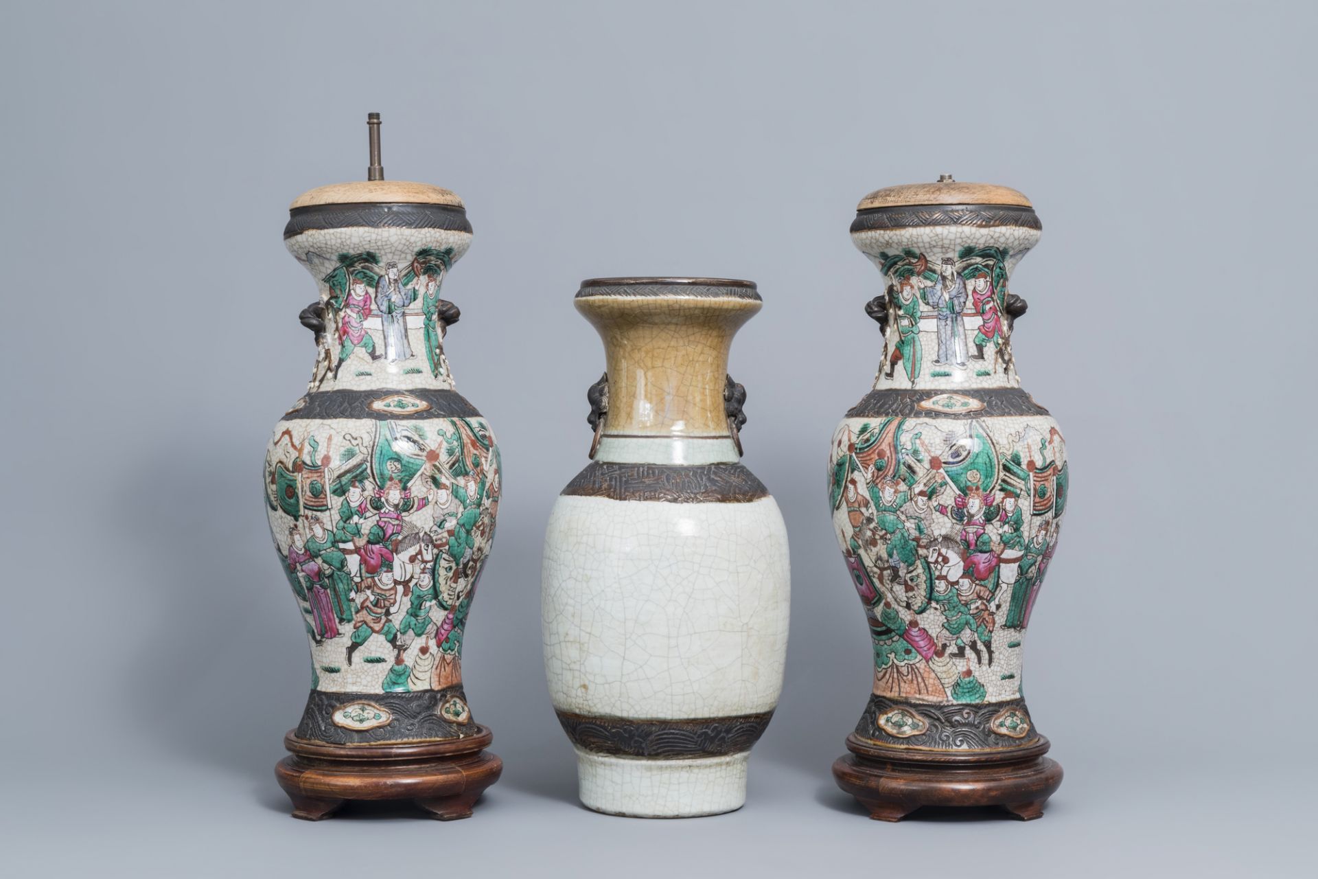 A pair of Chinese Nanking famille rose vases with warrior scenes & a Nanking celadon vase, 19th C.