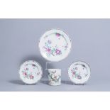Two Chinese famille rose plates and a charger with floral design and a famille verte brush pot with